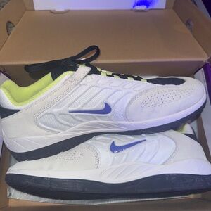Nike White and Black Sneakers with Blue Swoosh